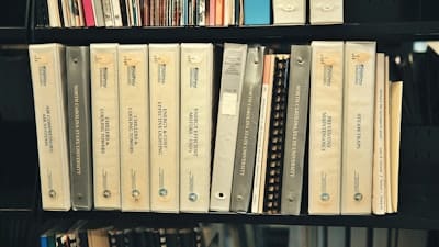 3 ring binders tha are part of job scanning legal files.